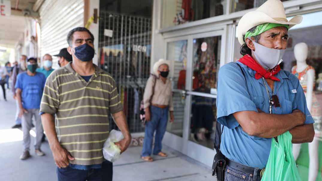 Getty/Mario Tama. A man waits in line to fill out unemployment forms in Imperial County, California, which is 85 percent Latino and has been hit hard by the COVID-19 pandemic, on July 24, 2020.